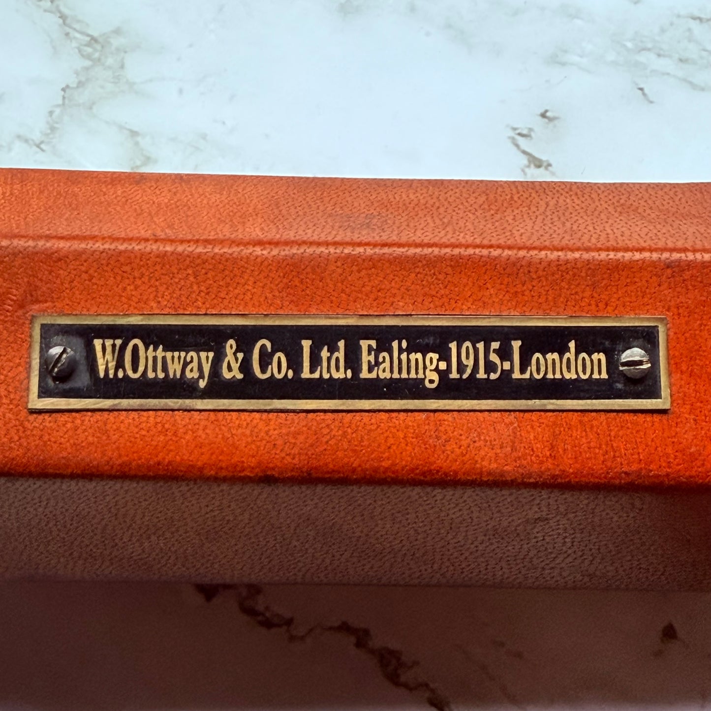Detailed photo of plate on spyglass that reads "W. Ottway & Co. Ltd. Ealing-1915-London"