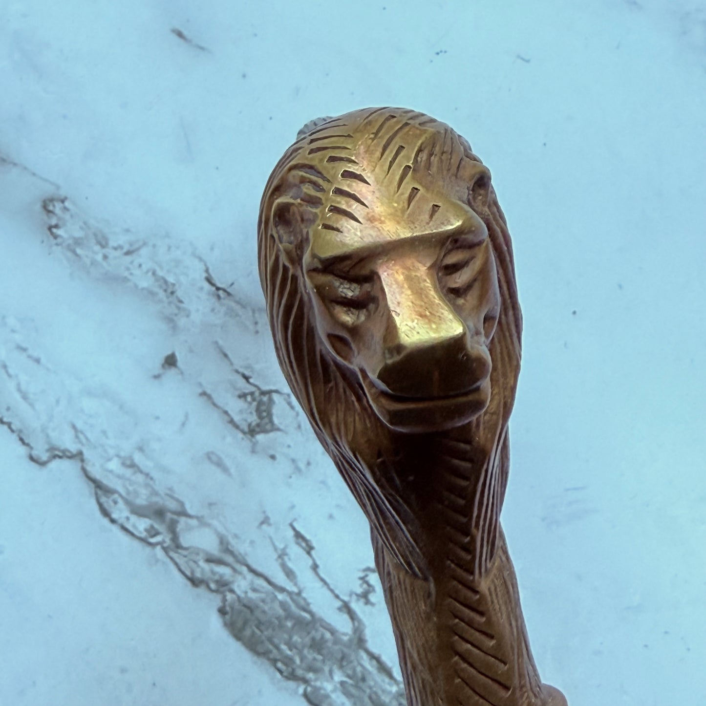 Brass walking cane handle with a detailed lion's head
