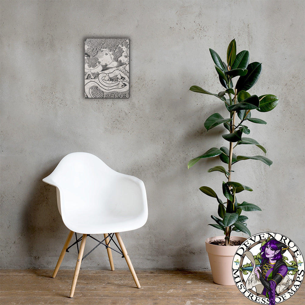 A 12" by 16" canvas print of the Magical Arch map by Deven Rue hangs on a wall behind a chair and a rubber tree plant.