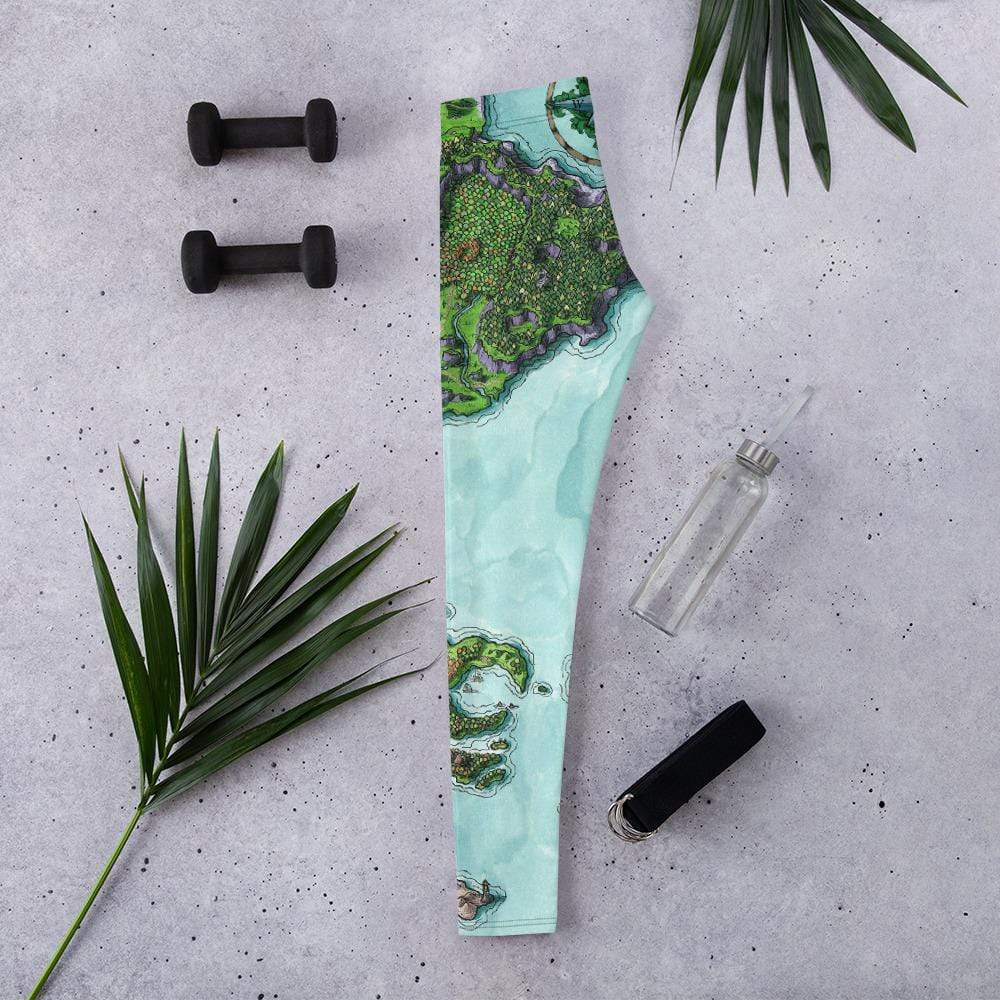 The Euphoros leggings by Deven Rue sitting folded flat with exercise accessories.