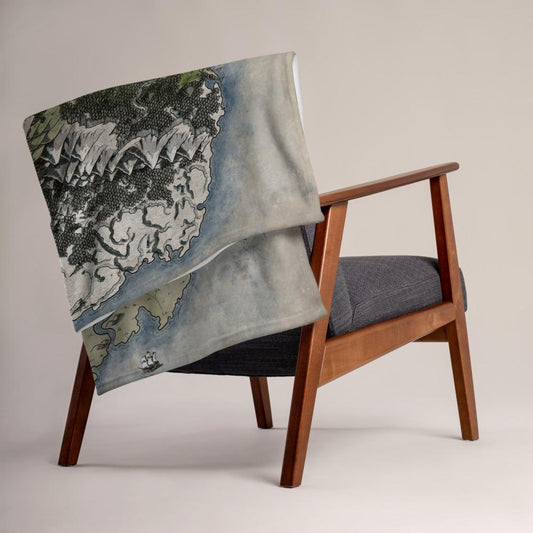 The Vendras map by Deven Rue is printed on a minky blanket, folded up on the back of a chair.