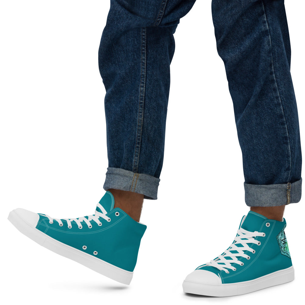 A model wears the teal high top shoes with the Discovering the Gate underwater hex map by Deven Rue on the heel with rolled up jeans.