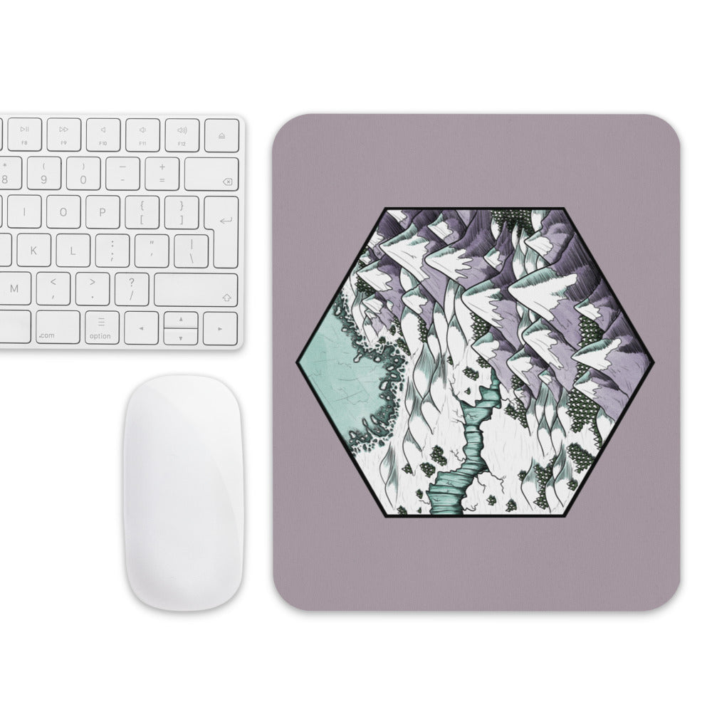 The Winter's Edge mousepad with a mouse and keyboard for scale.