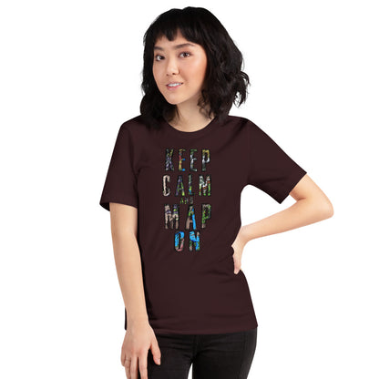 A model wears an oxblood shirt that says "Keep calm and map on" with bits of map visible on the writing.A model wears the Keep Calm and Map On shirt in oxblood.
