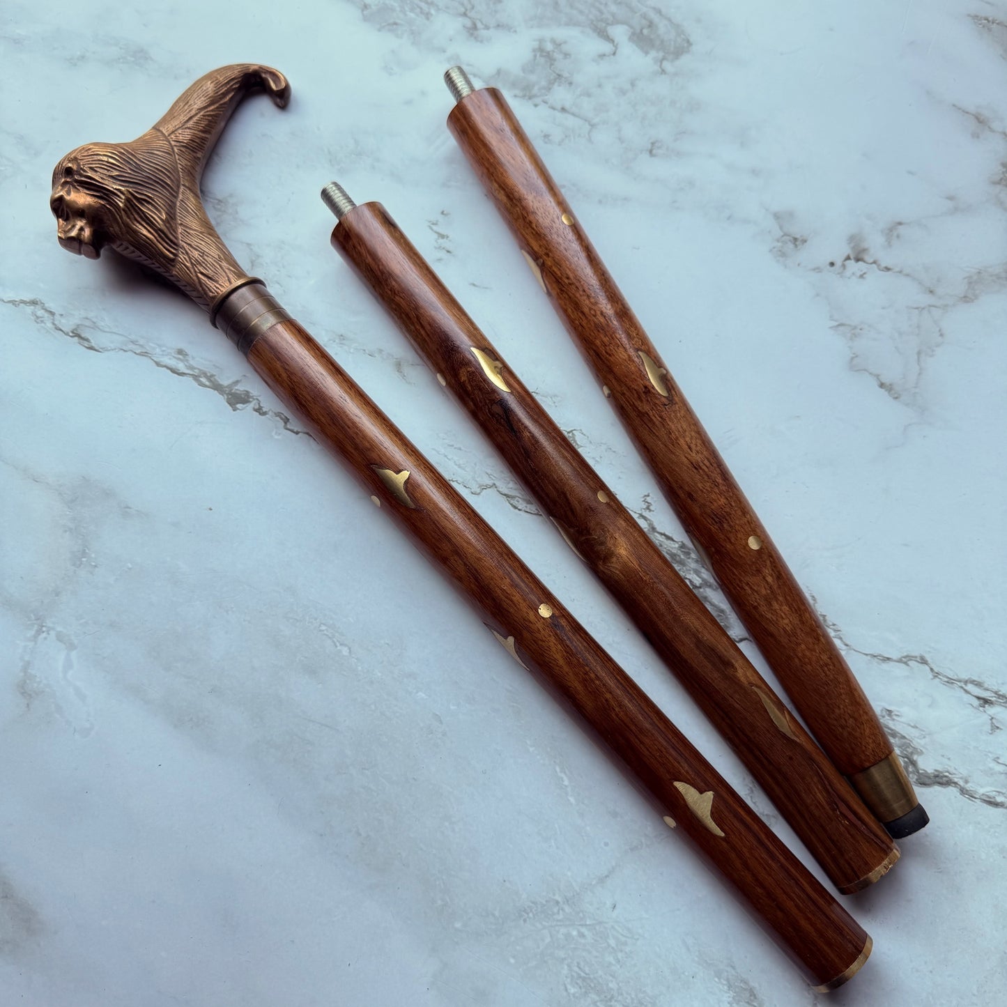 The cane broken down into 3 sections