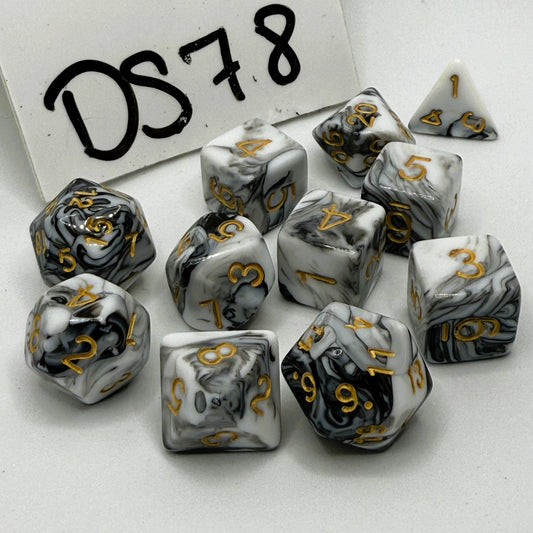 Set of black and white marbled dice with gold numbers on a white background, labeled 'DS78'.