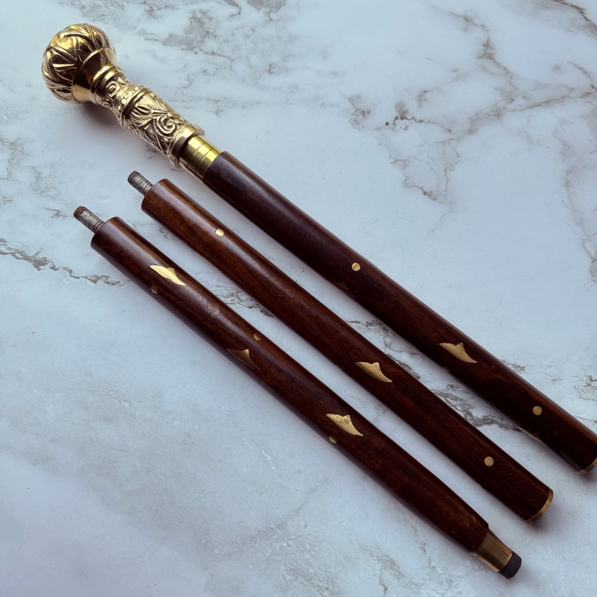 Decorative Victorian cane made from brass and wood broken down into 3 parts