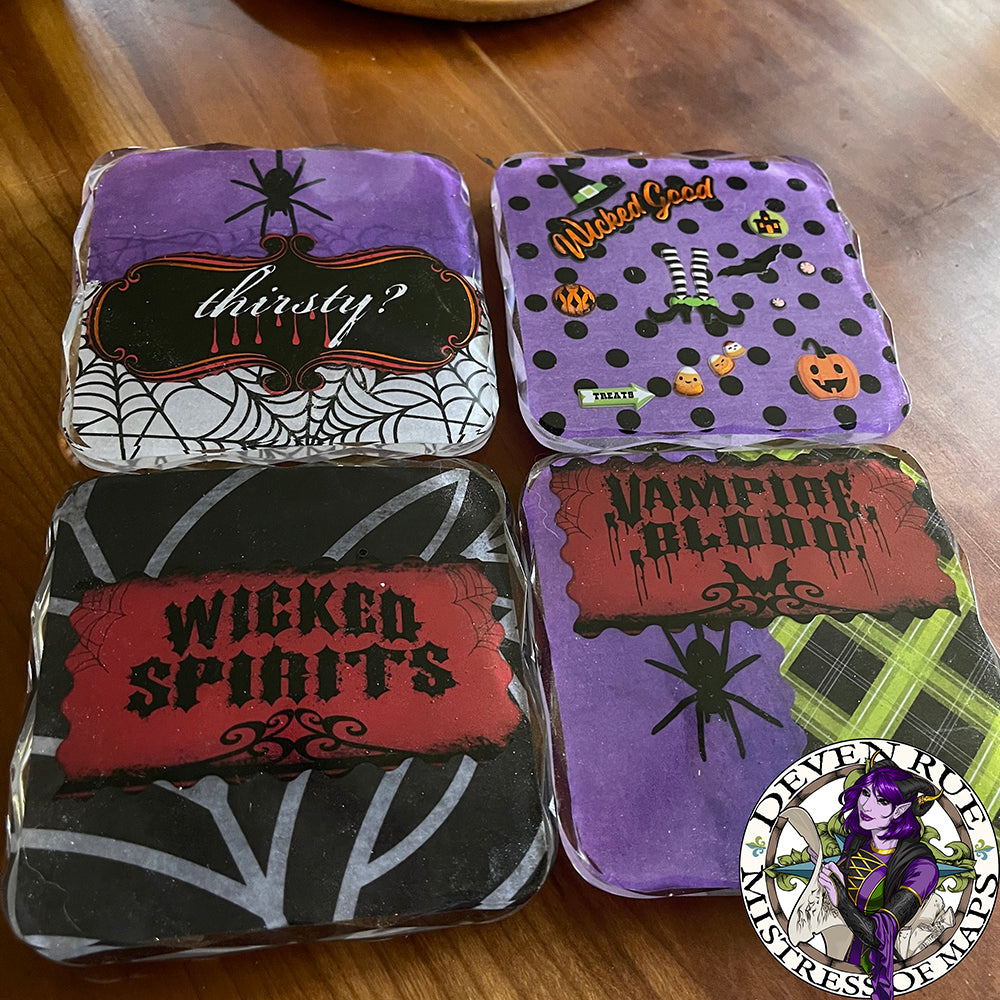 Another view of the set of Halloween coasters with spider, vampire, and witch themes.