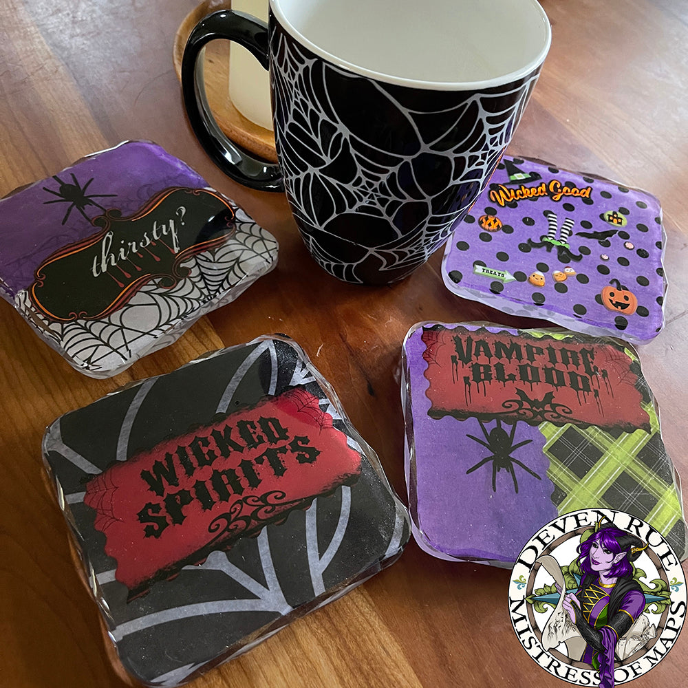 The four coasters in the Halloween set with a coffee mug for scale.