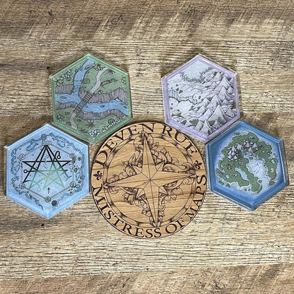 A set of four Hex Map coasters featuring different maps by Deven Rue.