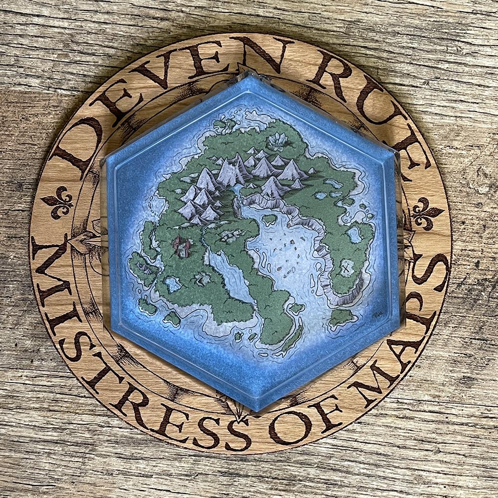 The Skycaller Island Hex Map coaster on the Deven Rue wooden logo.