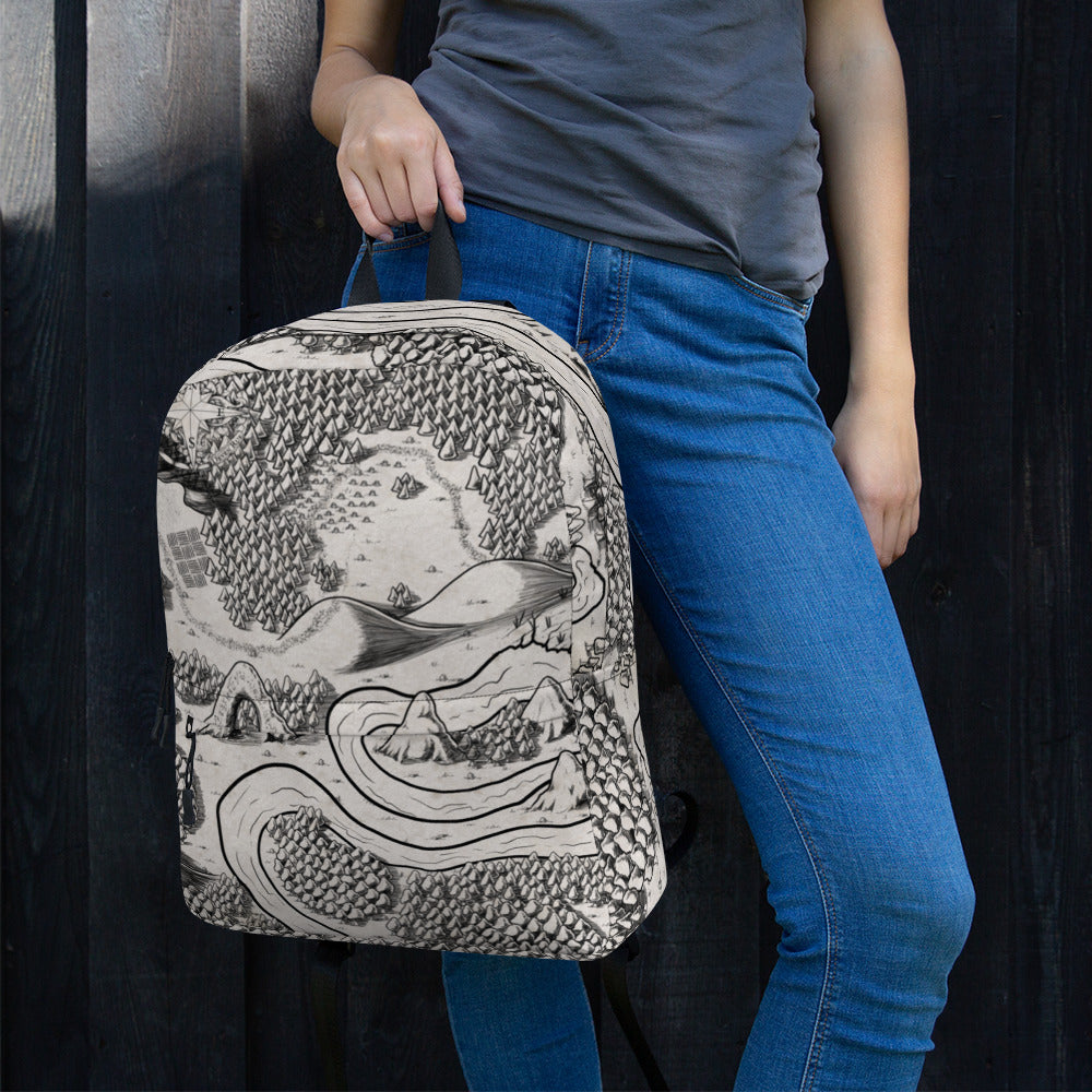 A model holds a backpack with the Magical Arch map by Deven Rue printed on it.