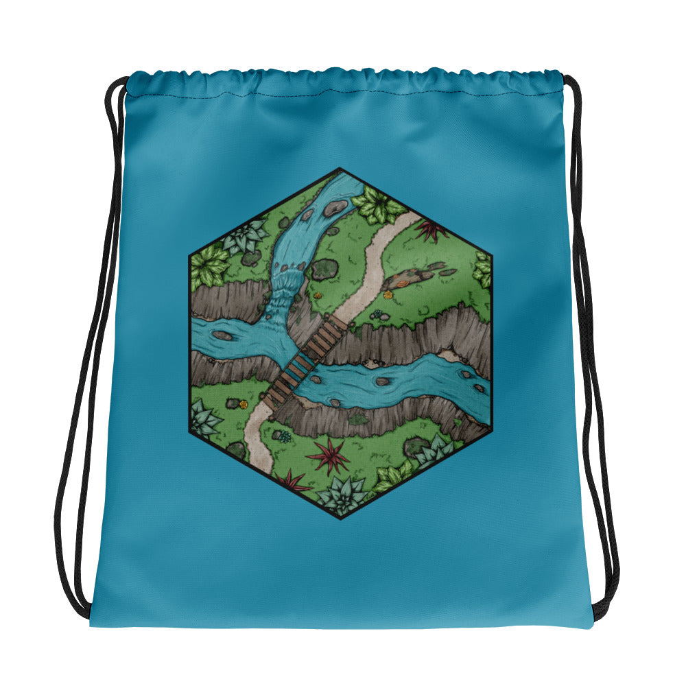A drawstring bag in blue with a hexagonal portion of a river crossing map.