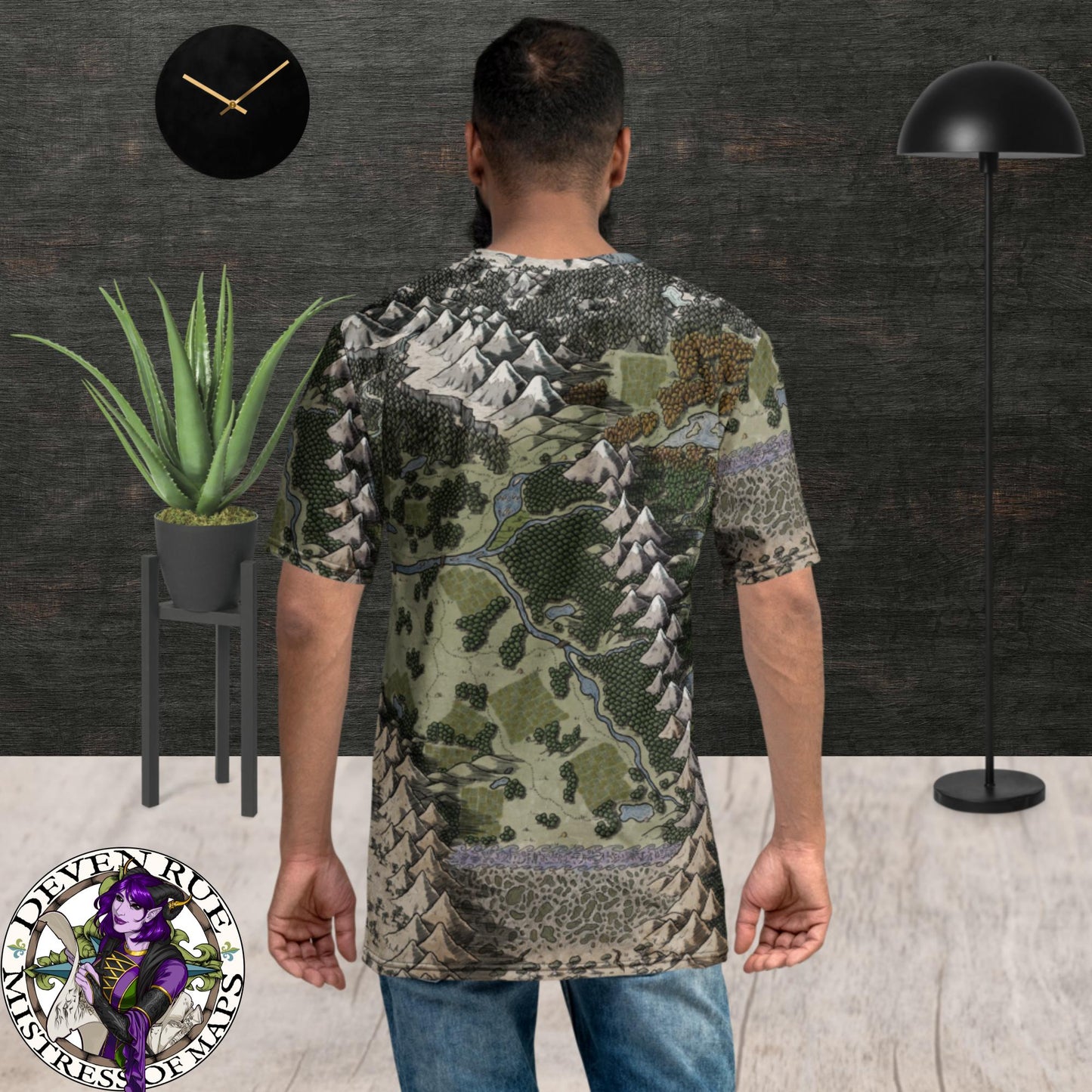 Back view: A model wears a crew neck tee shirt with the Vendras map by Deven Rue printed on it.