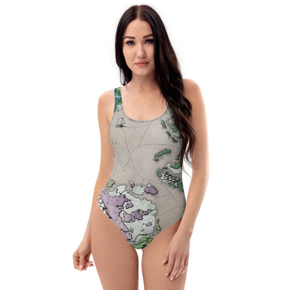 A model wears the Ortheiad map one piece swimsuit by Deven Rue.