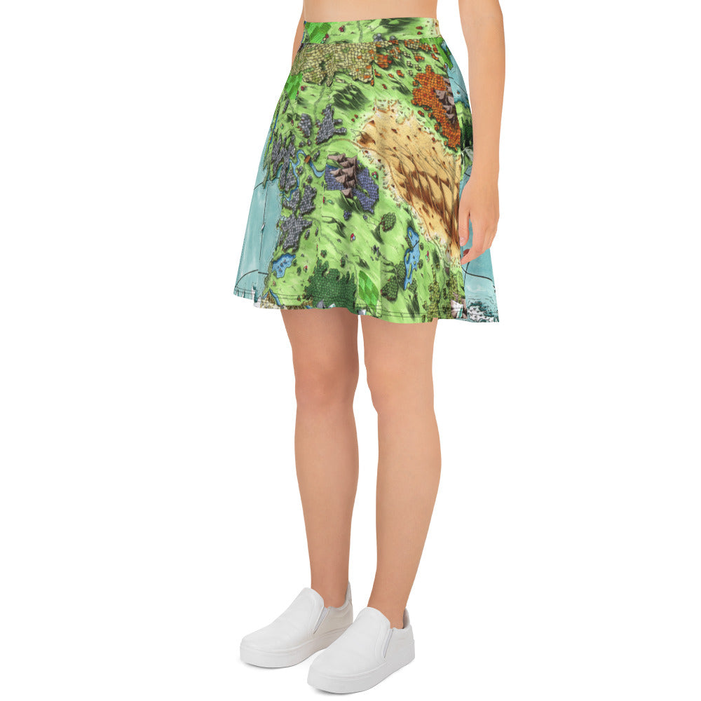 Left side view: A model wears a flared skater style skirt printed with the Queen's Treasure map by Deven Rue.