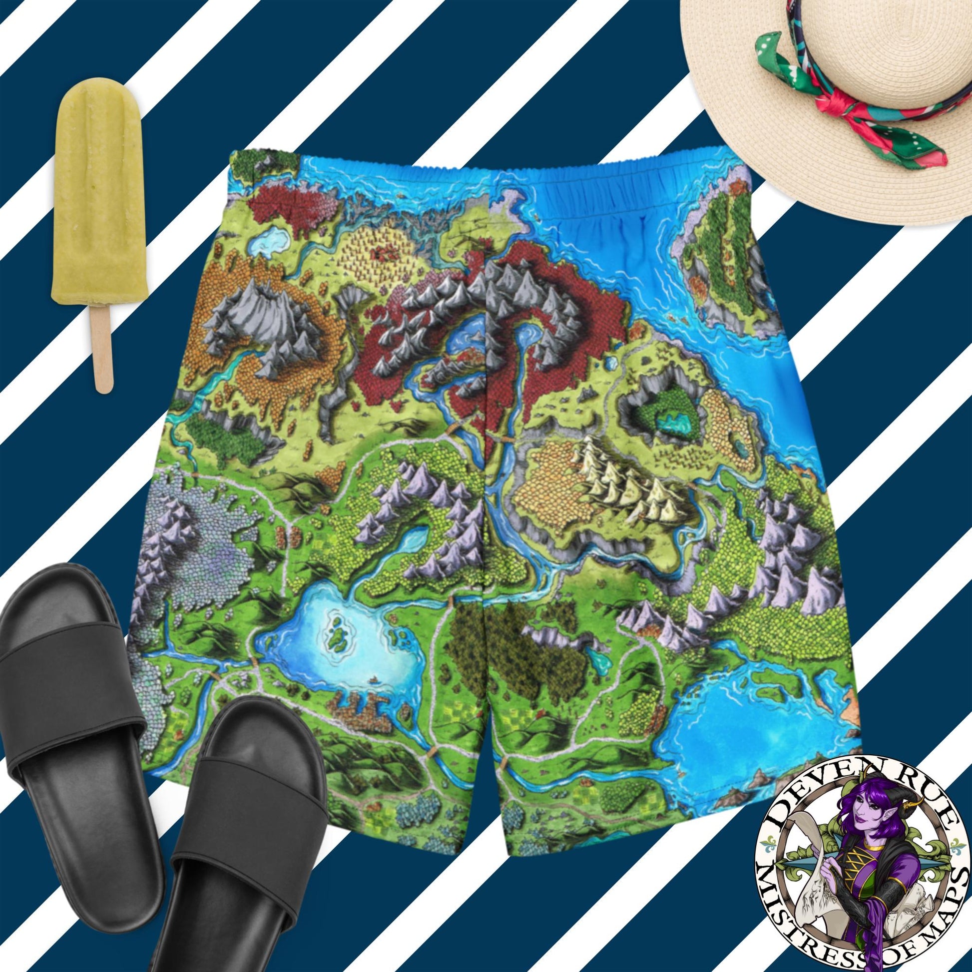 Swim trunks with the Taur'Syldor map sit on a blue and white striped surface with sandals, hat, and ice cream pop.