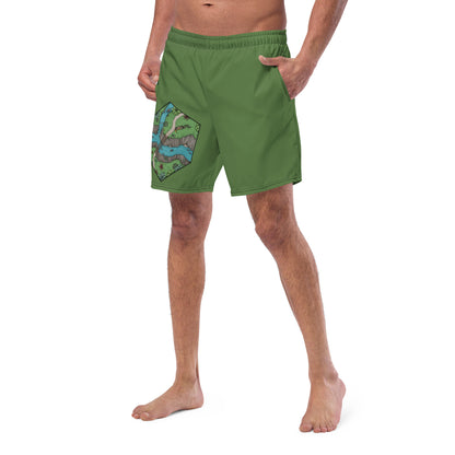 A model wears fern green swim trunks with the Perilous Crossing hex map by Deven Rue.