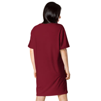 A model wears a burgundy t-shirt dress, back view.