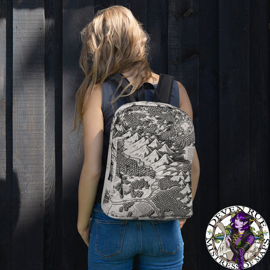 A model wears a backpack with the Arriving at Port map by Deven Rue printed on it.