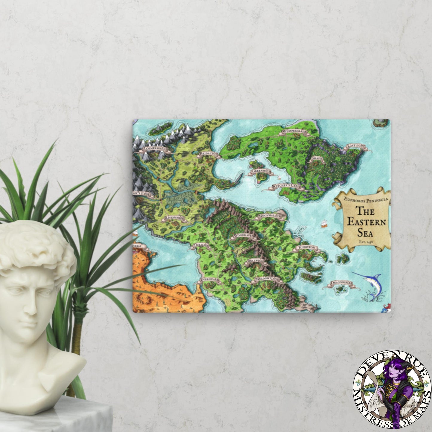 A 12" by 16" canvas print of the Euphoros map by Deven Rue hangs on a wall behind a plant and a bust statue.
