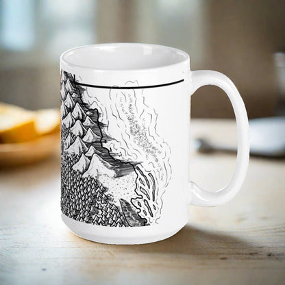 A black and white map showing a beach and mountains by Deven Rue wraps around a white mug.