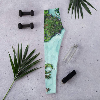 The Euphoros leggings by Deven Rue sitting folded flat with exercise accessories.