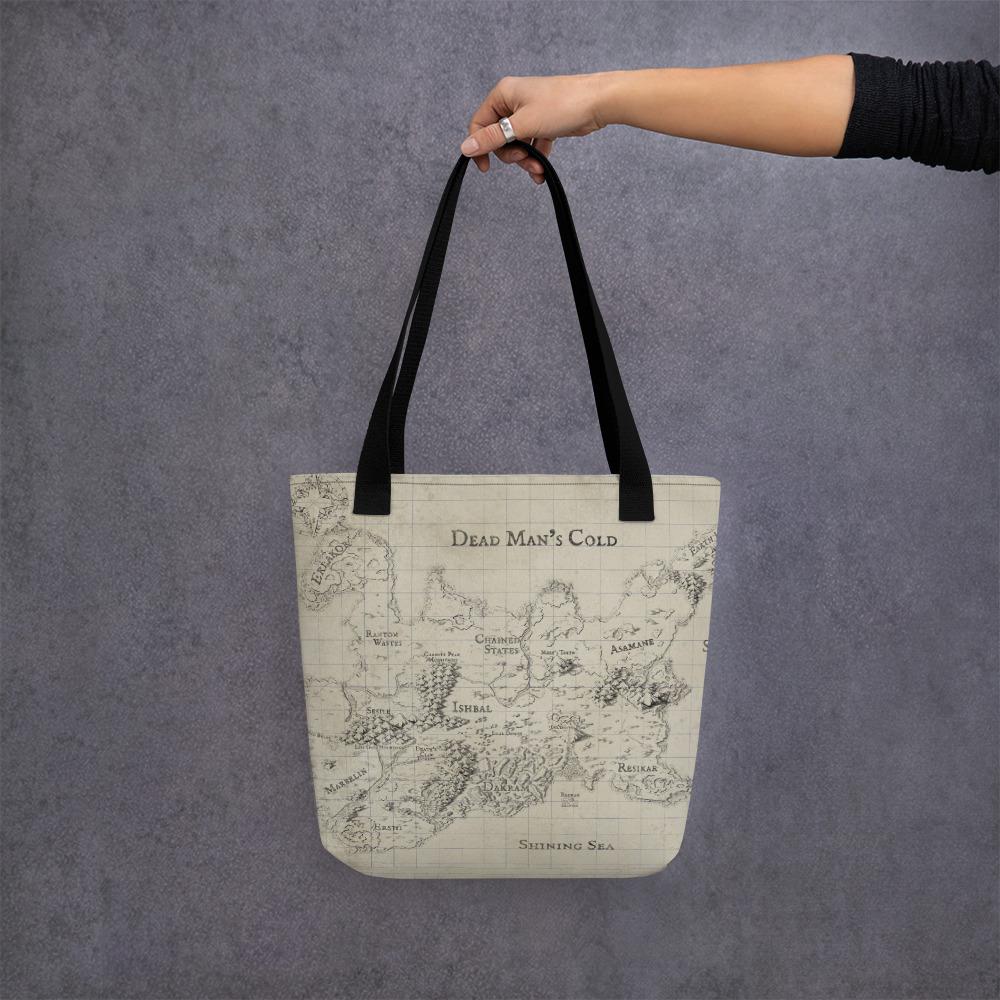 A model holds a tote bag featuring the Kroako map by Deven Rue.