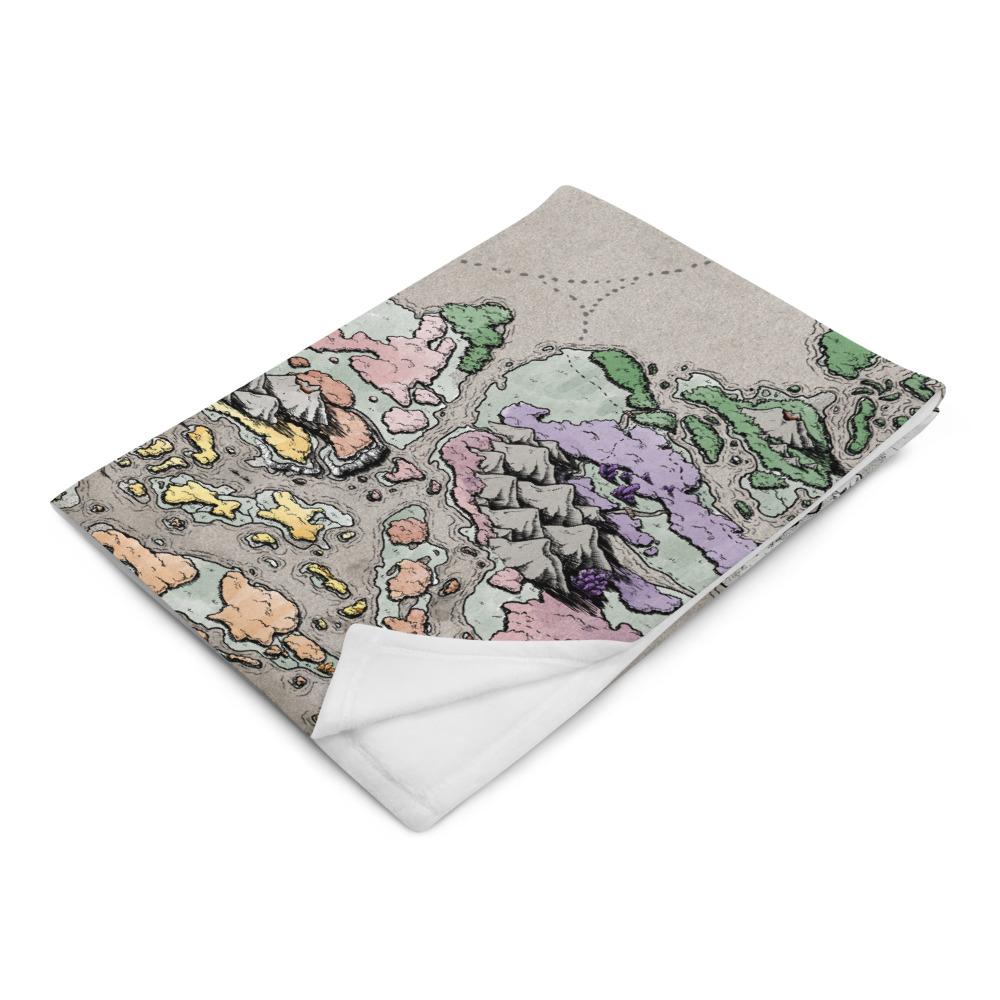 The Ortheiad map by Deven Rue is printed on a minky blanket which is folded neatly.