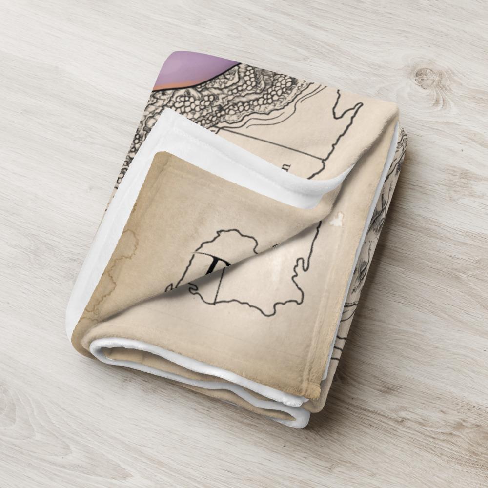 Rue the Cartographer throw blanket by Deven Rue folded into a neat rectangle.