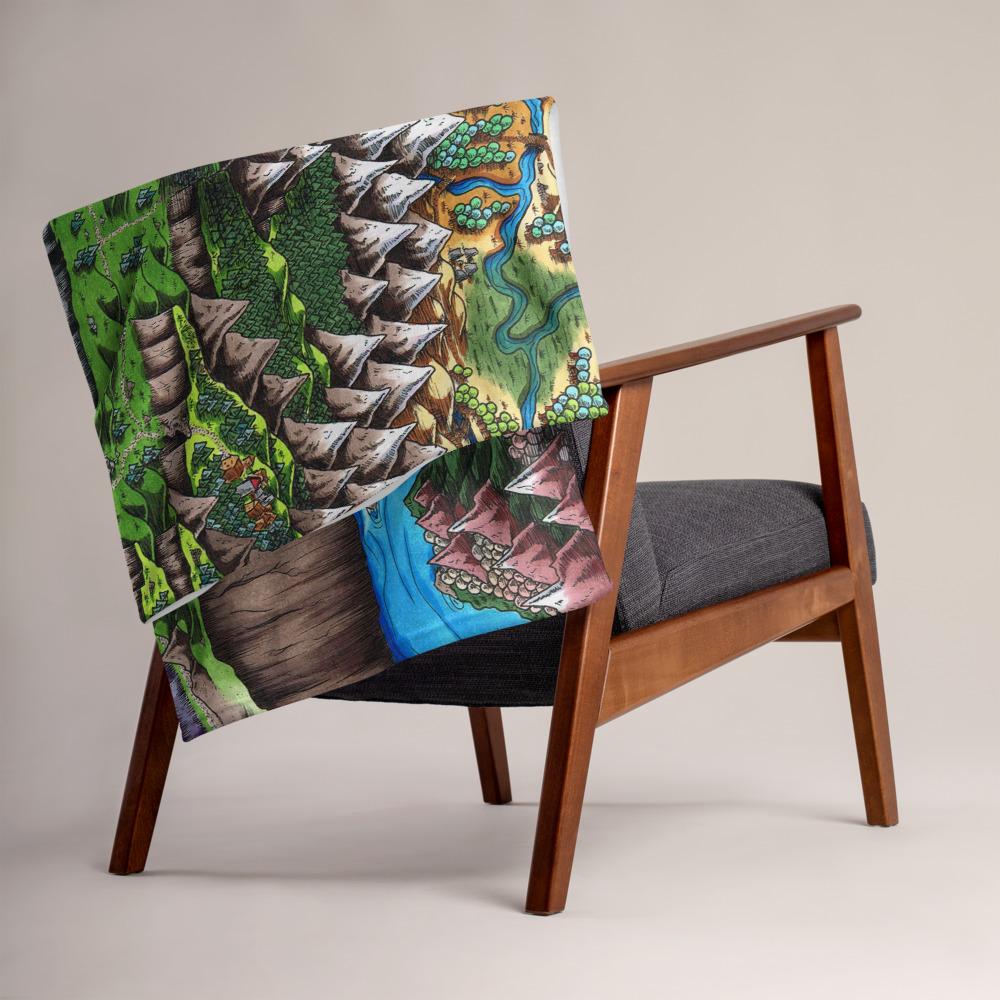 The Steppes of Augrudeen map by Deven Rue is printed on a minky blanket, folded up on the back of a chair.