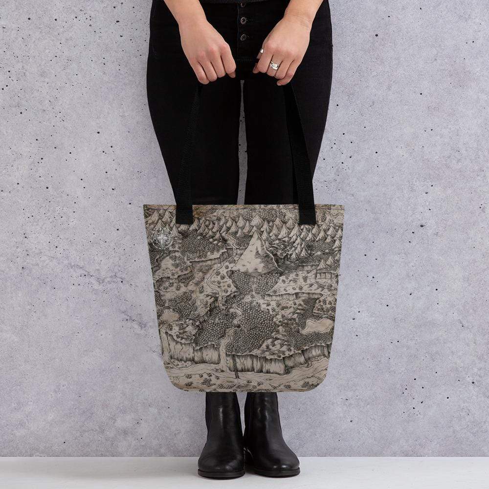 A model holds a tote bag featuring a black and tan map by Deven Rue.