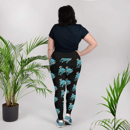 Back View: A model wears black leggings with small blue octopi all over them.