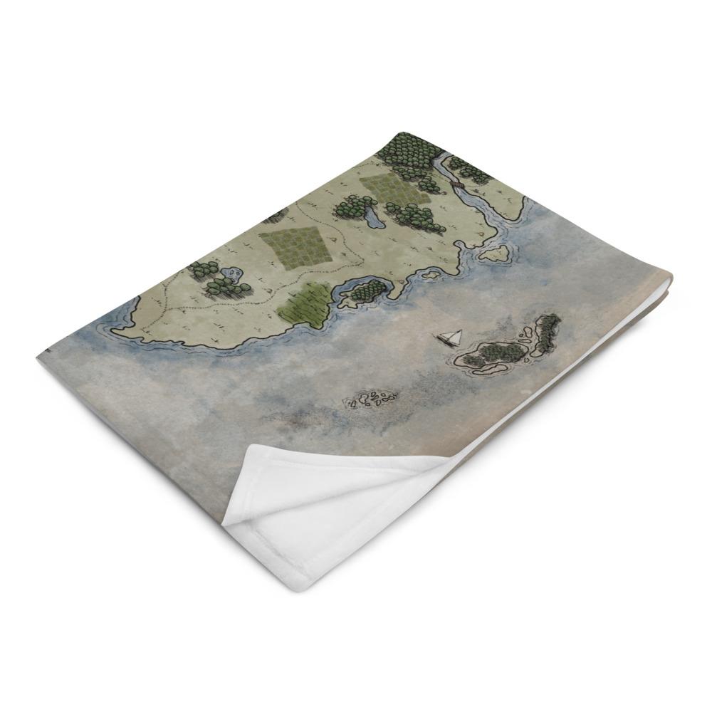 The Vendras map by Deven Rue is printed on a minky blanket, folded up.