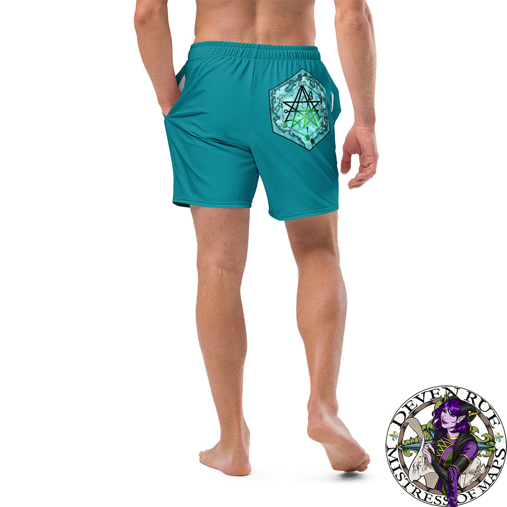 A model wears teal swim trunks with the Discovering the Gate hex map by Deven Rue.
