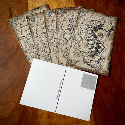 Postcards with a sepia map of an island on one side and a blank side to write on.