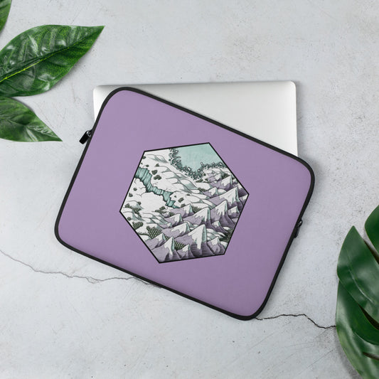 A laptop sleeve in lilac with a hexagonal snowy landscape illustration in hues of lilac and mint.