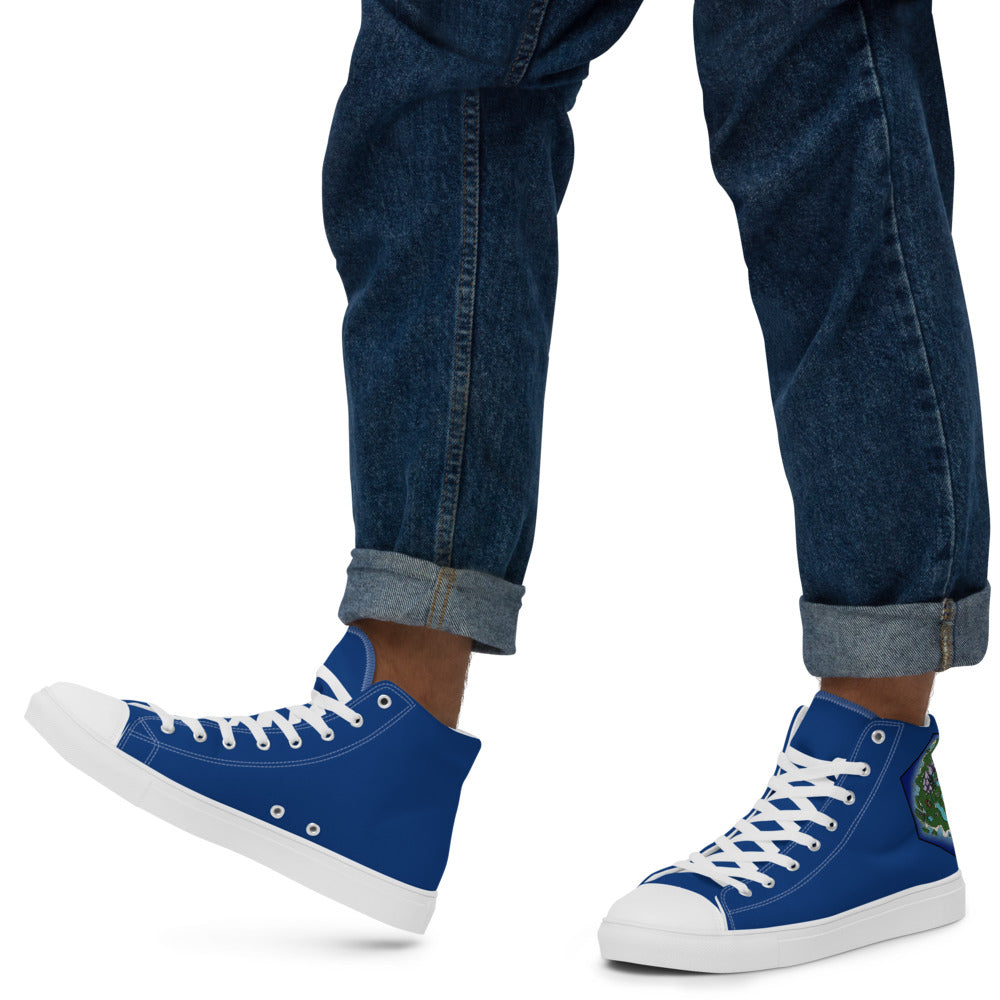 Blue high top shoes with the Skycaller Islands hex map by Deven Rue on the heel, worn by a model with rolled up jeans.