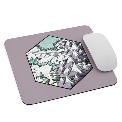 A pastel purple mousepad with the Winter's Edge hex map illustration and a mouse for scale.