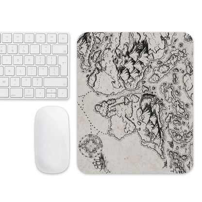 The Ship Graveyard map mousepad with a mouse and keyboard for scale.