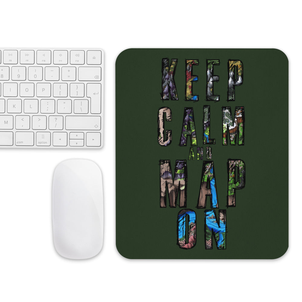 A forest green mousepad with "Keep calm and map on" next to a mouse and keyboard for scale.