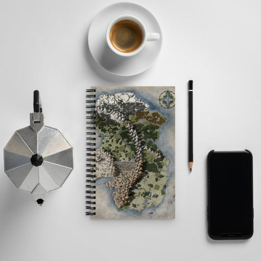 The Vendras map on the front of a spiral notebook, surrounded by coffee, cup, pencil, and phone.