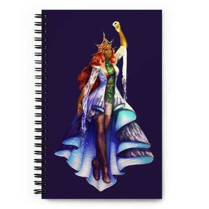 The Wandering Mistress illustration graces the front of a deep purple spiral notebook.