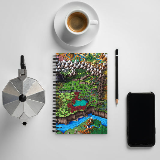 The Steppes of Augrudeen map graces the front of a spiral notebook with a kettle, cup and saucer, pencil, and phone for scale.