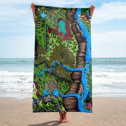 A model holds a towel with the Steppes of Augrudeen map by Deven Rue at the beach.