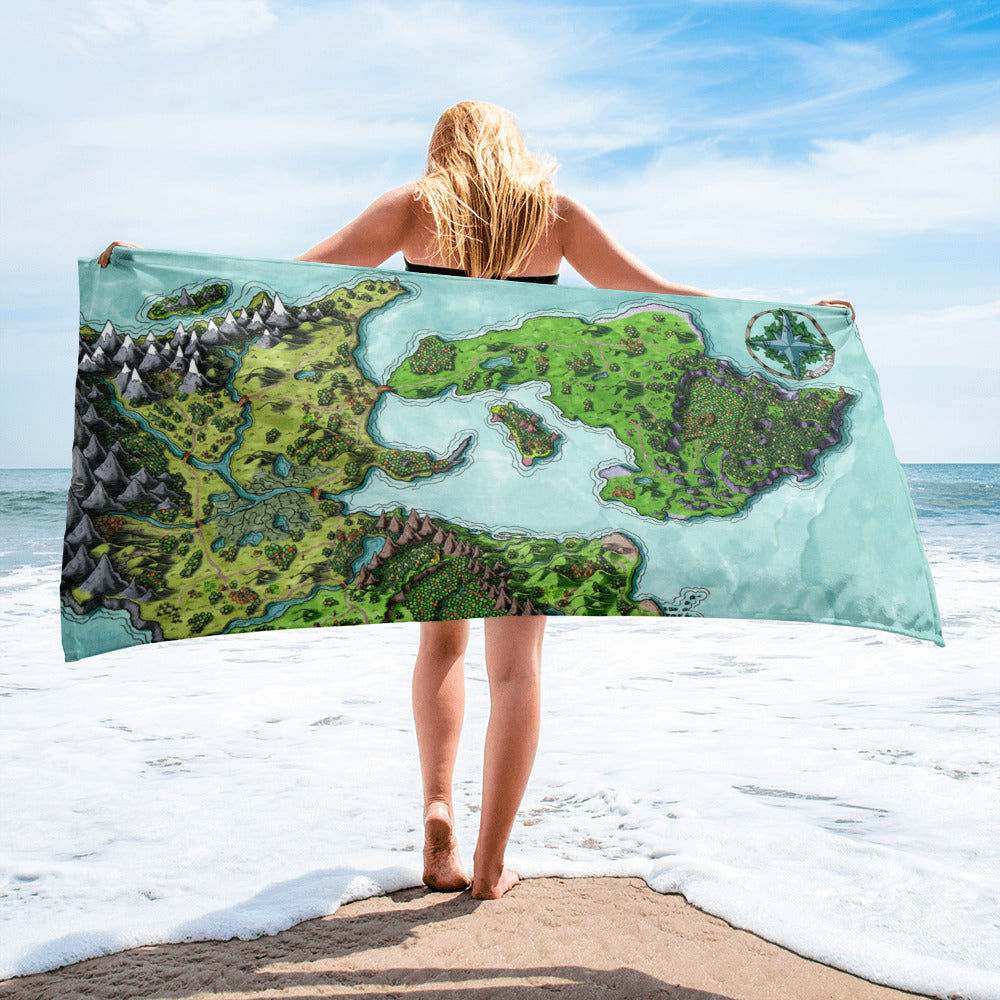 A model holds a towel with the Euphoros map by Deven Rue at the beach.