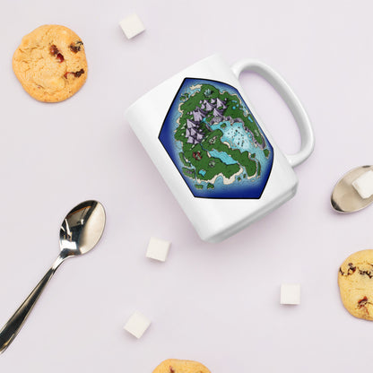 A mug with the hexagonal Skycaller Island sits with cookies, spoons, and sugar.
