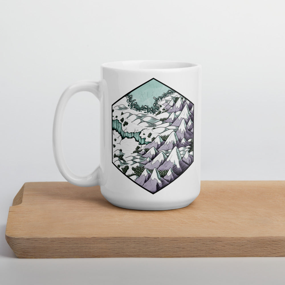 A hexagonal map illustration of a snowy, mountainous landscape on the side of a coffee mug.