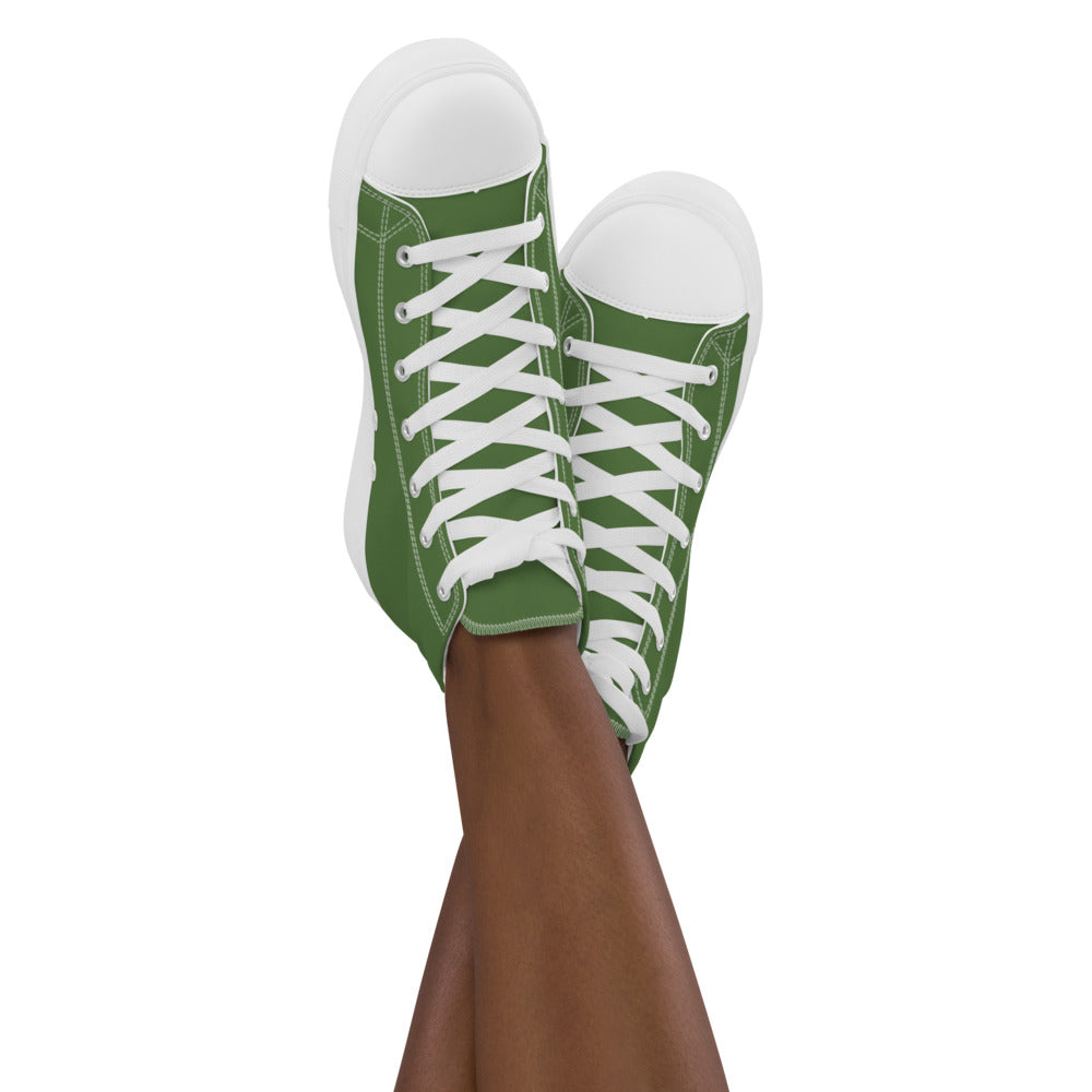 A model wears green high top shoes with the Perilous Crossing hex map illustration by Deven Rue on the heel.