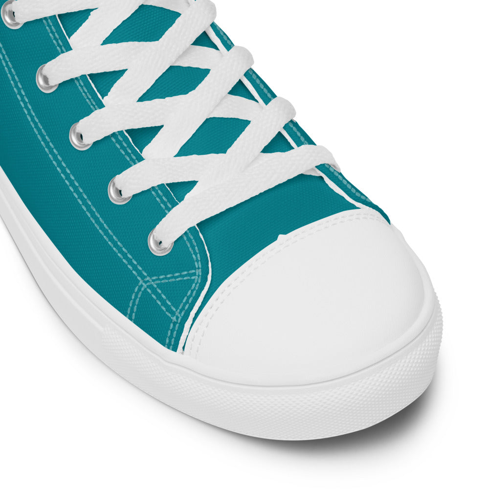 A close up of the toe of the teal Discovering the Gate teal high top shoe.